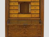 a wooden cabinet with drawers and drawers on top of it