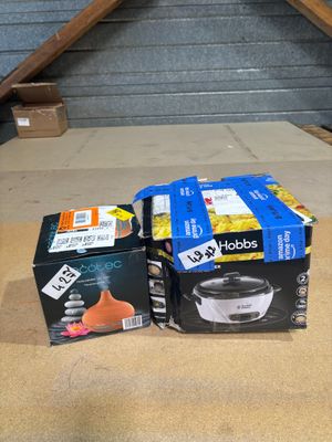 two boxes of food sitting on the floor next to a box of food