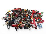 a pile of assorted toys on a white surface