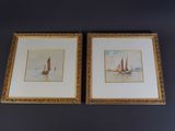 two framed watercolor paintings of sailboats on the water