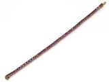 a close up of a purple bracelet on a white background