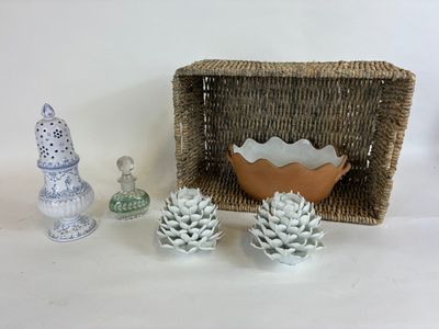 a basket with pine cones and a bowl with pine cones on it