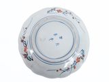 a blue and white bowl with a floral design on it