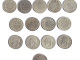 an image of a collection of old coins on a white surface