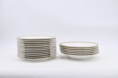 many plates stacked on top of each other on a table