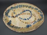 a blue and white plate with writing on it