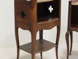 two small wooden tables with a cross on the top