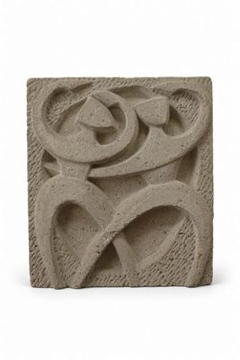 a close up of a stone block with a design on it