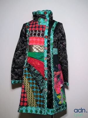an image of a colorful coat hanging on a wall