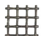 a close up of a piece of metal mesh on a white background