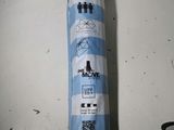 a blue and white umbrella hanging on the wall