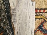 an image of a close up of a piece of paper on a rug