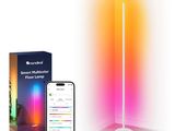 a smart light that is on the floor next to a phone