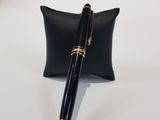 ballpoint pen in black and gold with a black case