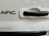 a close up of a car door handle with the word traffic written on it