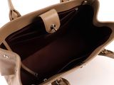 the inside of a tan handbag with a strap and a handle