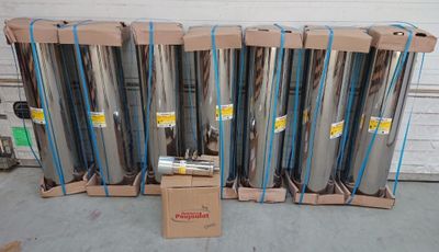 a lot of rolls of aluminum on a carton