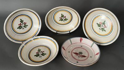six plates with floral designs on them sitting on a table