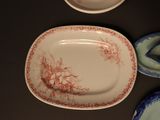 many plates that are sitting on a table