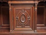a wooden cabinet that has a clock on it