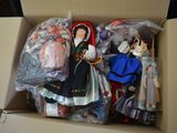 many dolls in a box that are in a box