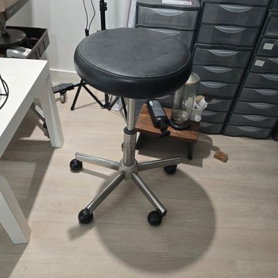 a desk with a chair and a computer on it