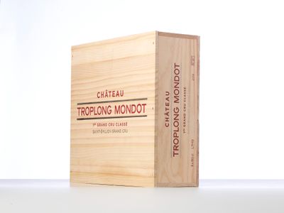a wooden box with a logo on it on a table