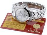 an image of a wrist watch sitting on top of a credit card