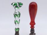 two glass vases that are sitting next to each other