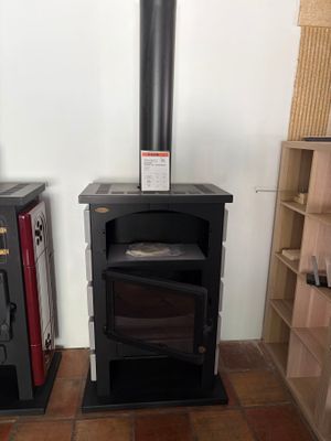 two wood burning stoves in the corner of a room