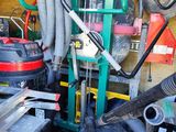 a pile of tools that are sitting in a garage
