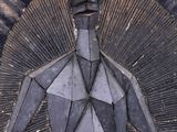 a metal sculpture of a man with a tie on