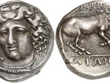 a silver coin with an image of a horse on it