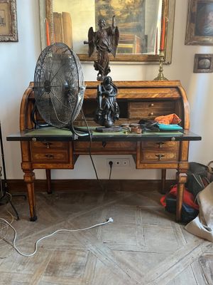 a desk with a fan and a fan on top of it