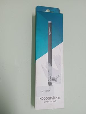 a box with a pen in it sitting on a table