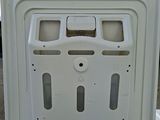 a white refrigerator that is open on the ground