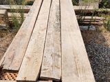 several pieces of wood are stacked on top of each other in a pile