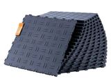 a stack of black tiles with a tag on it
