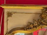 a mirror that is hanging on the wall in the room