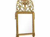 an ornate gold mirror with a white background and a white background