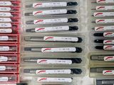 a lot of pens that are sitting in a box