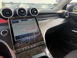 the dashboard of a car with a tablet on the dashboard