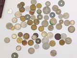 a lot of coins that are on the table