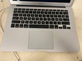 a laptop computer sitting on a table with a mouse