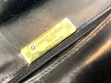 a close up of a purse with a label on it