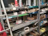 many shelves with various items on them in a room
