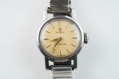 a watch that is sitting on a white surface