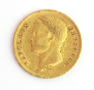 l'image d'une pièce d'or sur laquelle figure une tête de femme