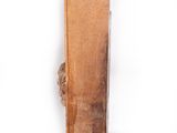 a piece of wood that is sitting on a white surface