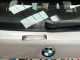 stickers on the windshield of a car that is parked in a parking lot